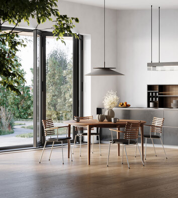 GM 3700 Ro Matbord Runt i kök med stora fönster som vetter ut mot grönskande natur