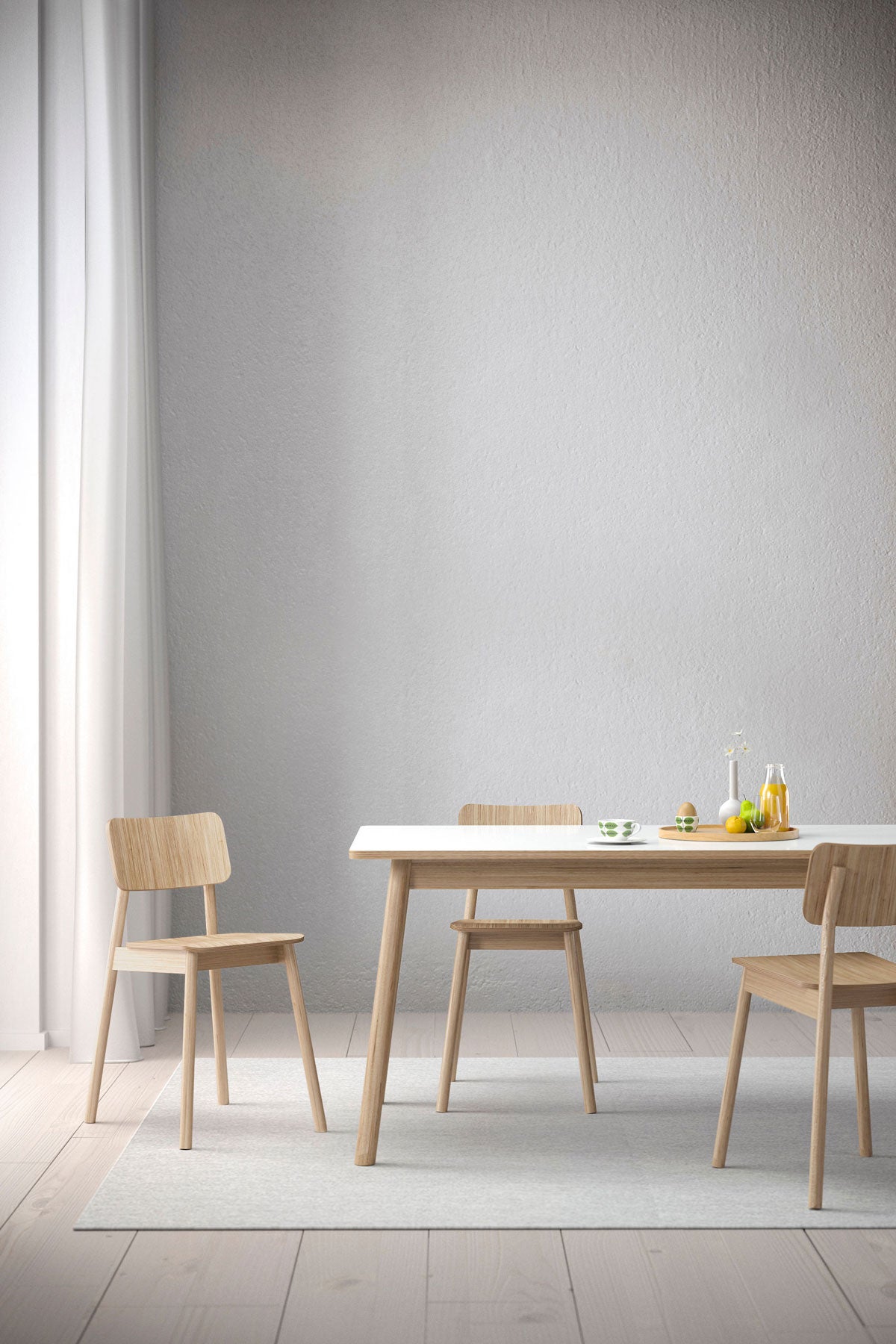 Dino bord 200 cm med tre stolar. Möblerna står på matta och det är uppdukat en frukost på bordet. 