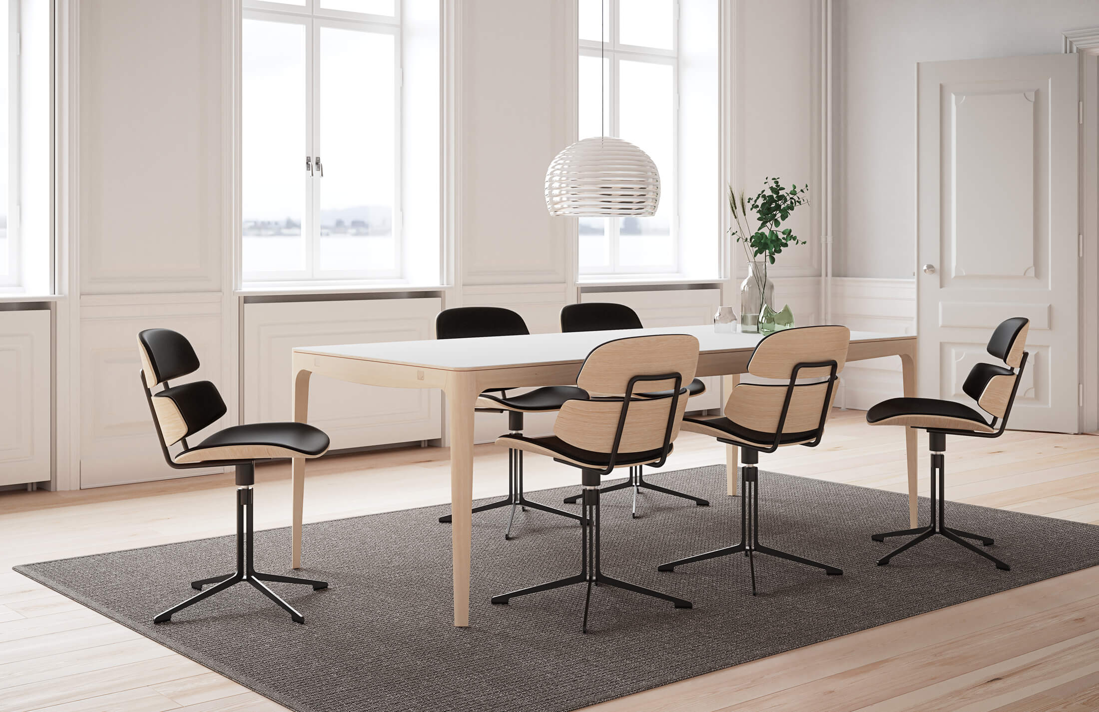 GM 3700 Ro Bord i matsal på brun matta med svarta matstolar